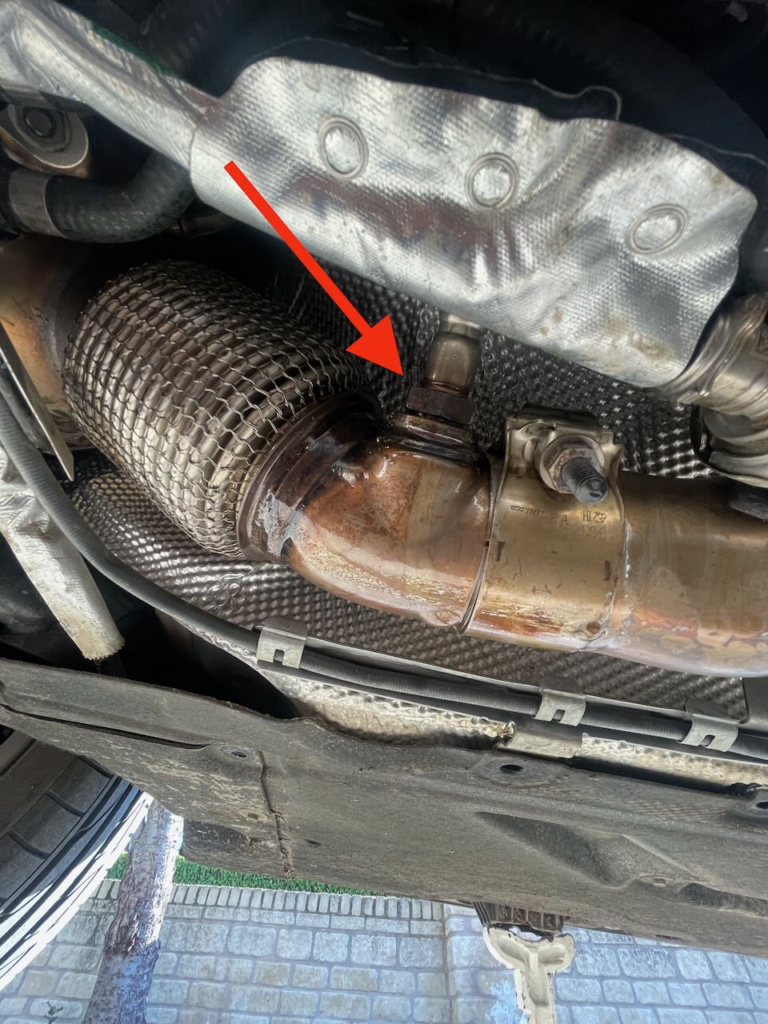 The location of the front NOx sensor in a BMW 1 series